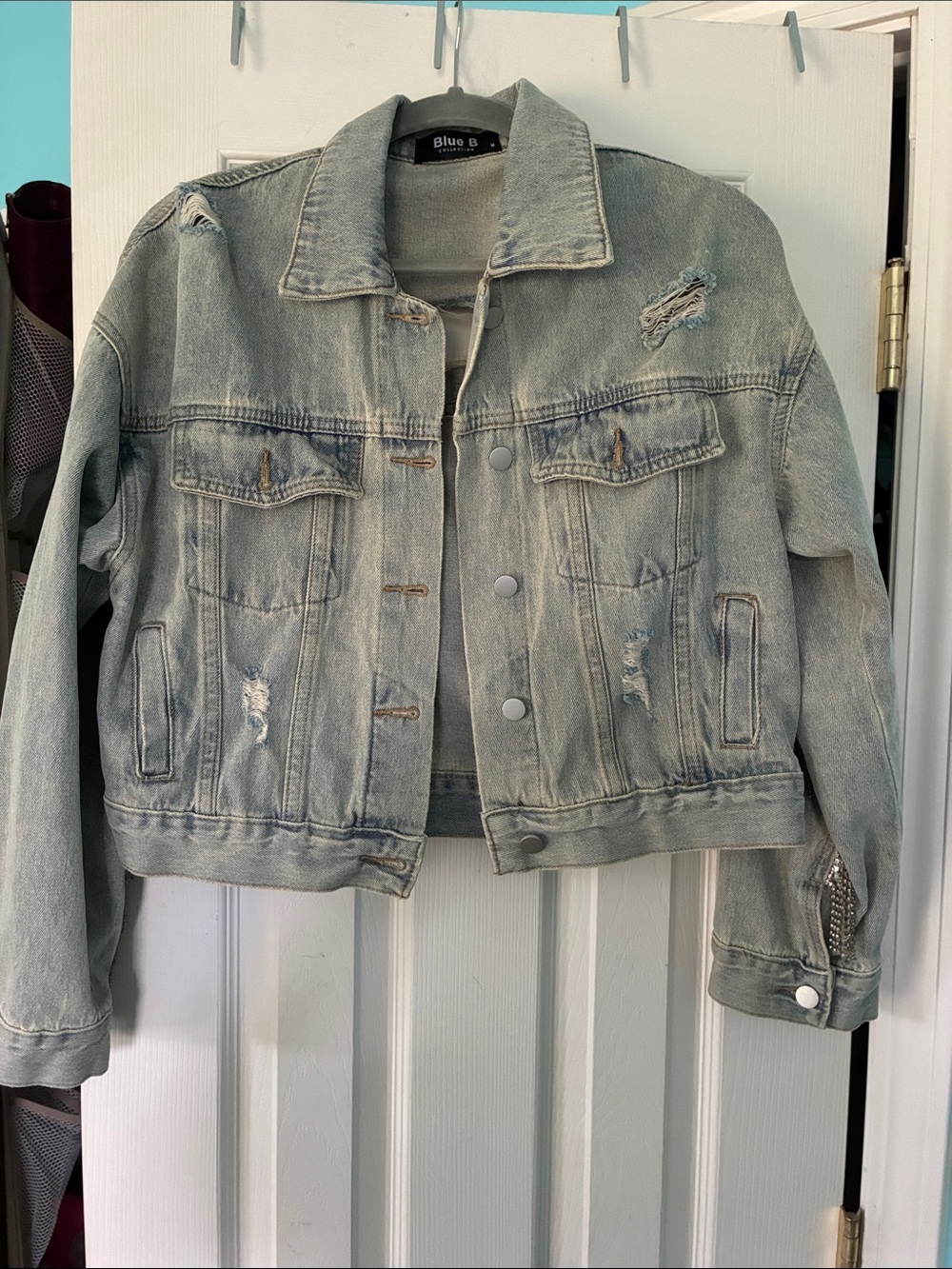 Denim jacket with rhinestone fringe